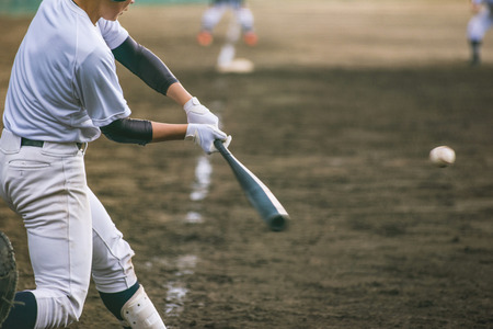 baseball player hitting a ball